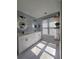 Bathroom with white double vanity, backlit mirrors, and natural lighting at 760 Whitehall Way, Roswell, GA 30076
