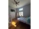 Comfortable bedroom with hardwood flooring, high ceilings, and a serene atmosphere at 760 Whitehall Way, Roswell, GA 30076