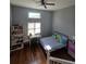 Cozy bedroom with hardwood floors, ample natural light, and neutral paint at 760 Whitehall Way, Roswell, GA 30076