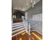 Inviting entryway with hardwood floors, staircase, and ample natural light at 760 Whitehall Way, Roswell, GA 30076
