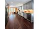 Well-lit kitchen boasting modern gray cabinetry, wood accents, and stainless-steel appliances at 760 Whitehall Way, Roswell, GA 30076