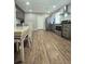 Eat-in kitchen has stainless steel appliances, gray cabinets, and wood-look floors at 760 Whitehall Way, Roswell, GA 30076