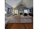 Bright living room showcases a fireplace, vaulted ceiling, and hardwood floors at 760 Whitehall Way, Roswell, GA 30076