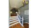 Inviting foyer boasting hardwood floors and staircase leading to the main living area at 760 Whitehall Way, Roswell, GA 30076