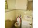 Modest bathroom featuring a toilet, sink with vanity, and a mirrored wall at 811 Verde Dr, Riverdale, GA 30274