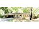 Charming single-story brick home with a welcoming carport and a well-maintained front yard at 811 Verde Dr, Riverdale, GA 30274