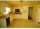 Functional kitchen with ample white cabinetry and countertop space, ready for updates at 811 Verde Dr, Riverdale, GA 30274