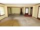 Open-concept living room featuring yellow walls and views into adjacent rooms, showing an open floor plan at 811 Verde Dr, Riverdale, GA 30274