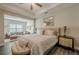 A beautifully decorated bedroom with hardwood floors and upholstered furniture at 3877 Via Cima Ln, Suwanee, GA 30024