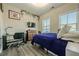 Bedroom with modern decor, carpet, desk, bed, and plenty of natural light at 3877 Via Cima Ln, Suwanee, GA 30024