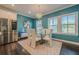 This modern dining room features a glass table, white chairs, and a contemporary chandelier at 3877 Via Cima Ln, Suwanee, GA 30024