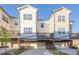 Modern townhome with attached garage, private decks, and attractive curb appeal at 3877 Via Cima Ln, Suwanee, GA 30024