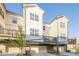 Stylish townhome with attached garage, private deck, and manicured front lawn at 3877 Via Cima Ln, Suwanee, GA 30024