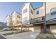 Charming townhome with attached garage, private deck, and well-maintained landscaping at 3877 Via Cima Ln, Suwanee, GA 30024