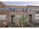 Brick townhome featuring black shutters and a welcoming front entrance at 3877 Via Cima Ln, Suwanee, GA 30024