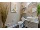 Elegant powder room with stylish vanity and decorative accents at 3877 Via Cima Ln, Suwanee, GA 30024