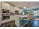 This is a spacious kitchen with stainless steel appliances, a kitchen island and bar stool seating at 3877 Via Cima Ln, Suwanee, GA 30024