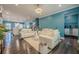 Open-concept living space with bright lighting, modern decor, and seamless flow from kitchen to living area at 3877 Via Cima Ln, Suwanee, GA 30024