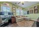 Bright home office featuring comfortable couch, monitors, and neutral decor at 3877 Via Cima Ln, Suwanee, GA 30024