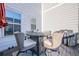 A patio featuring a round table, four chairs, and a barbeque grill at 3877 Via Cima Ln, Suwanee, GA 30024
