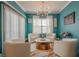 Sitting room with natural light, modern light fixture, and hardwood floors at 3877 Via Cima Ln, Suwanee, GA 30024