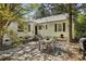 Backyard patio with outdoor seating, a grill, landscaping, and greenery at 391 Collier Nw Rd, Atlanta, GA 30309