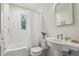 Well-lit bathroom includes a tub/shower combo, tiled walls, vintage fixtures, and ample counter space at 391 Collier Nw Rd, Atlanta, GA 30309