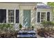 Close-up of the home's front entrance with black shutters and a light-blue door at 391 Collier Nw Rd, Atlanta, GA 30309