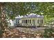 Charming home with mature trees and tidy landscaping creating an inviting curb appeal at 391 Collier Nw Rd, Atlanta, GA 30309