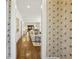 Inviting hallway view into the living room, featuring hardwood floors and stylish wallpaper at 391 Collier Nw Rd, Atlanta, GA 30309