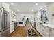 Spacious kitchen featuring stainless steel appliances, white cabinetry, and smooth transition into other living areas at 391 Collier Nw Rd, Atlanta, GA 30309