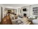 Bright living room with fireplace, hardwood floors, and open layout to the dining room at 391 Collier Nw Rd, Atlanta, GA 30309