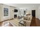 Spacious living room with fireplace, hardwood floors, and access to the kitchen at 391 Collier Nw Rd, Atlanta, GA 30309
