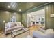 Inviting living room connected to a kitchen with stainless steel appliances, combining style and functionality at 391 Collier Nw Rd, Atlanta, GA 30309