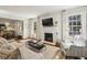 Elegant living room features hardwood floors, fireplace, and an open-concept design at 391 Collier Nw Rd, Atlanta, GA 30309