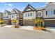 Charming townhomes feature manicured lawns, neutral paint, and attached garages at 605 Stone Field Nw Run, Marietta, GA 30060