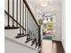 Elegant foyer featuring hardwood floors, a staircase, and a view to the front door at 605 Stone Field Nw Run, Marietta, GA 30060