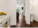 Hallway leading to open-concept living space and half-bath with pedestal sink at 605 Stone Field Nw Run, Marietta, GA 30060