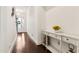 Bright hallway with hardwood floors, elegant console table, and decorative accents at 605 Stone Field Nw Run, Marietta, GA 30060