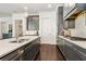 Kitchen with stainless steel appliances, gray cabinets, white marble countertops and dark hardwood floors at 605 Stone Field Nw Run, Marietta, GA 30060
