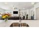 Modern kitchen with a stainless steel sink, marble countertops, and an open view to the living room at 605 Stone Field Nw Run, Marietta, GA 30060