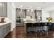 Kitchen features stainless steel appliances, gray cabinets, and a sleek island with barstool seating at 605 Stone Field Nw Run, Marietta, GA 30060