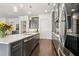 Modern kitchen features quartz countertops, stainless steel appliances, and stylish gray cabinets at 605 Stone Field Nw Run, Marietta, GA 30060