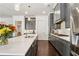 Well-equipped kitchen with grey cabinets, stainless steel appliances, and a spacious island with a sink at 605 Stone Field Nw Run, Marietta, GA 30060