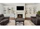 Cozy living area with a fireplace flanked by built-in shelving at 605 Stone Field Nw Run, Marietta, GA 30060
