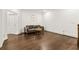 Bright living room with hardwood floors, a gray couch, a gold table, and a decorative clock at 605 Stone Field Nw Run, Marietta, GA 30060