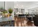 Open-concept view of kitchen and living room with dark wood floors and gray cabinets and furniture at 605 Stone Field Nw Run, Marietta, GA 30060
