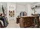 Walk-in closet with custom shelving and an ornate chest of drawers and plenty of storage space at 605 Stone Field Nw Run, Marietta, GA 30060