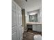 Well-lit bathroom featuring a vanity with cabinets and a shower/tub combination at 7235 Hummingbird Ln, Winston, GA 30187