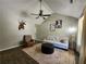 Cozy living room with vaulted ceilings, neutral tones, wood floors, and a ceiling fan at 7235 Hummingbird Ln, Winston, GA 30187